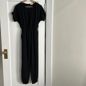 Black short sleeve jumpsuit with rolled sleeves